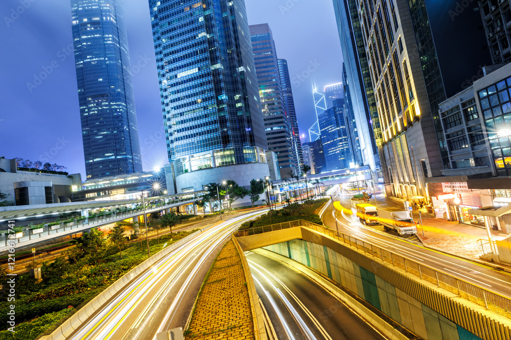 Hong Kong at night traffic with streets and skyscrapers in Hong Kong, China Hong Kong at night traffic with streets and skyscrapers in Hong Kong, China