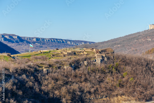 Obraz na płótnie Tsarevets Fortress on a hill with a cloudy sky in the background w salonie