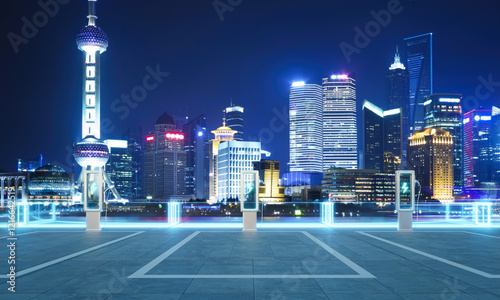 Photography Electric vehicle charging station illuminating shanghai skyline at night