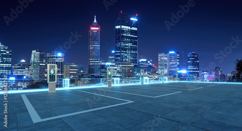 Fototapeta Naklejka Na Ścianę i Meble -  Electric vehicle charging stations illuminating perth city skyline at night