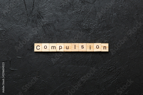 compulsion word written on wood block. compulsion text on table, concept