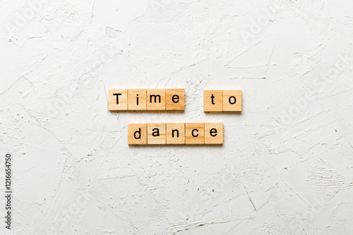 time to dance word written on wood block. time to dance text on cement table for your desing, concept photo