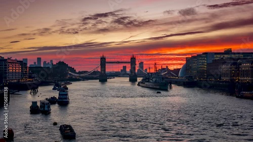 Panoramic sunrise time lapse view of theTower Bridge and River Thames in London, England, with river and street traffic