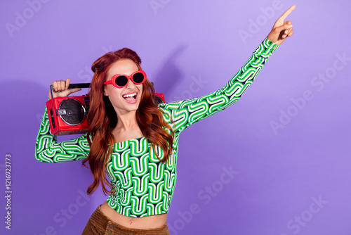 Energetic woman wearing stylish attire points upwards in a vibrant dance-themed composition photo