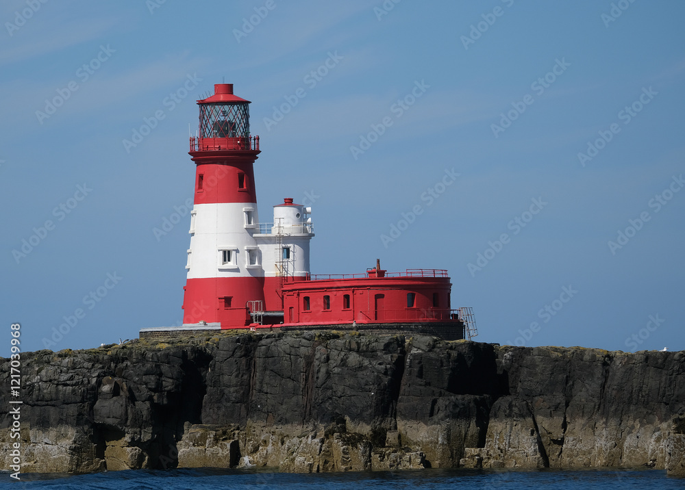 Longstone Lighthouse is an active 19th century lighthouse on Longstone Rock in the outer group of the Farne Islands off the Northumberland Coast, England. Longstone Lighthouse is an active 19th century lighthouse on Longstone Rock in the outer group of the Farne Islands off the Northumberland Coast, England.