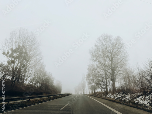 Foggy road, bad conditions on autodrive photo