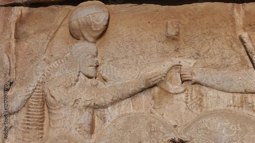 Naqsh-e Rostam necropolis of Persepolis in Fars Province with tomb of Darius I the Great, Iran. The tombs of the ancient Persian kings are decorated with bas-reliefs carved into the rocks