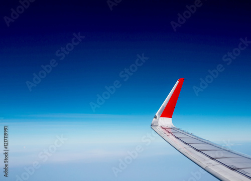 Looking Out the Window of a Plane, Blue sky landscape.