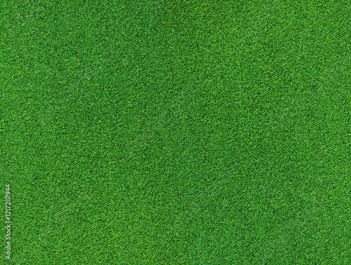 Artificial grass, covering. Artificial green grass mat, top view. Texture. Background. Artificial turf, surface made of synthetic fibers. Flat green grass texture background. Short grass