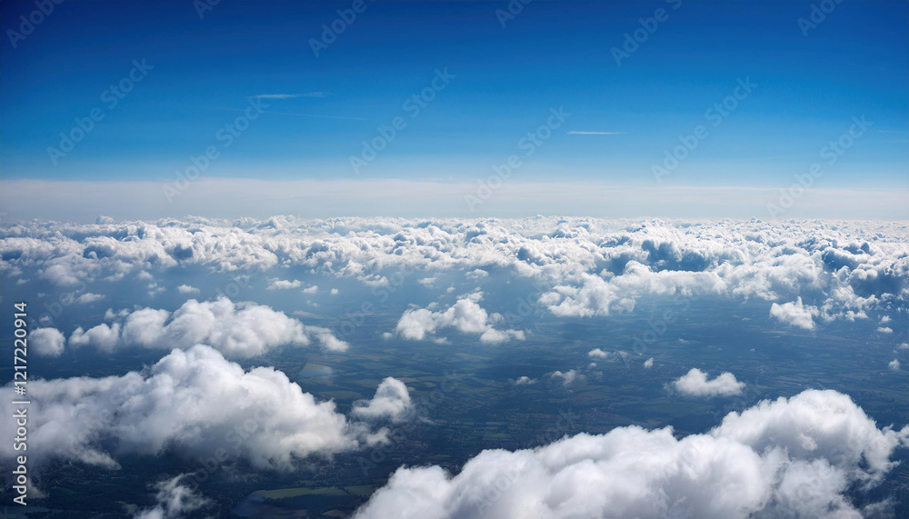 Fluffy white clouds float across a vibrant blue sky, creating a serene and tranquil aerial landscape. Fluffy white clouds float across a vibrant blue sky, creating a serene and tranquil aerial landscape.