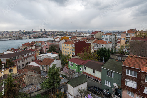 Panorama view of Istanbul from the Fatih district near the Yavuz Sultan Selim Mosque, Turkey. Golden horn, Galata tower, clouds, ferries and roofs photo