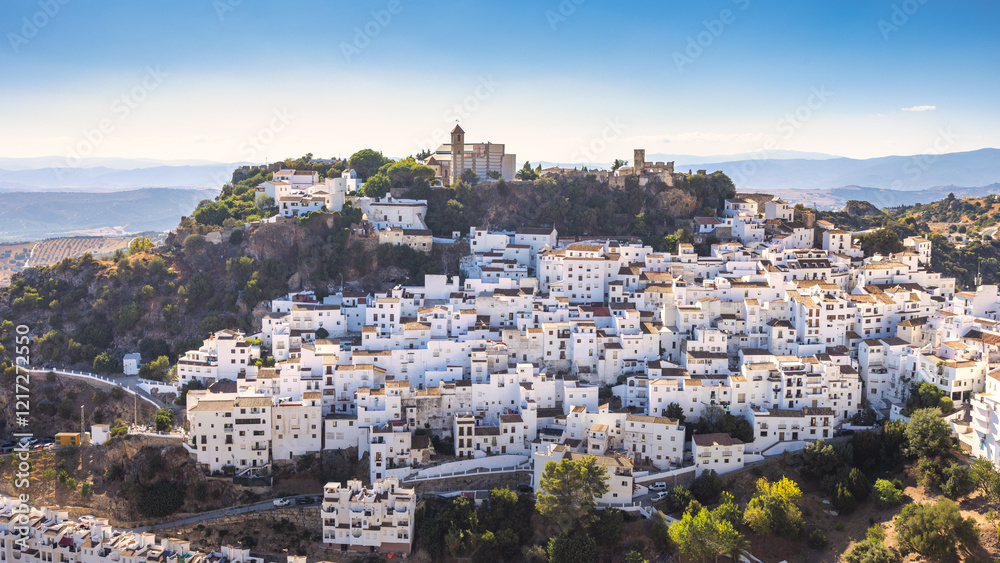 Fototapeta premium Casares town in Andalusia, Spain, Europe. Whitewashed hillside village under a clear blue sky. A stunning view of traditional architecture.