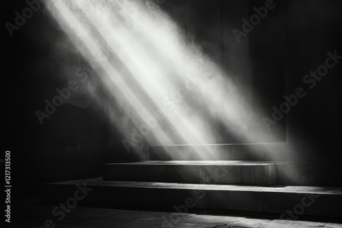 Light rays stream through an open door creating a dramatic contrast in a dark...