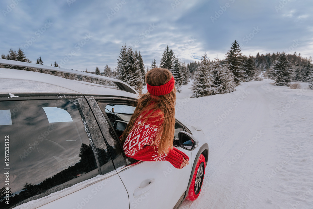 Woman Looking out of Car Window in Winter Forest