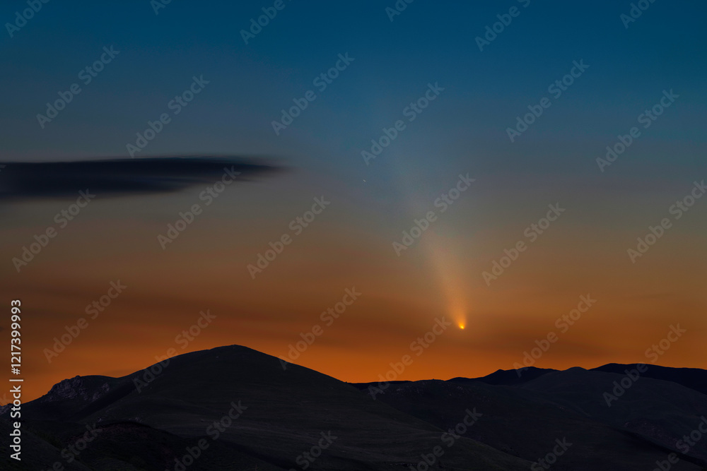 Beautiful comet over the mountains in the starry night. Beautiful comet over the mountains in the starry night.