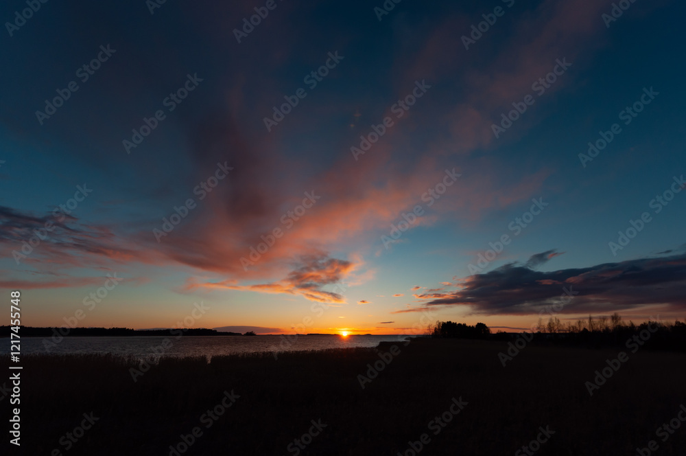Early morning clouds at sunset time in spring in Pori, Finland Early morning clouds at sunset time in spring in Pori, Finland