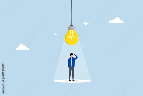 Innovation, clever entrepreneur pondering beneath a creative illuminated light bulb. 