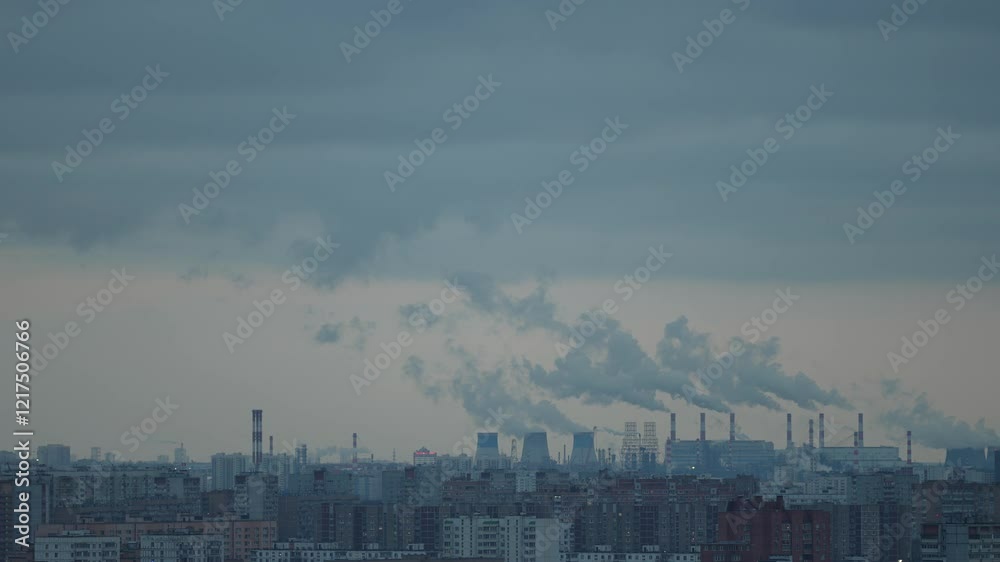smoke coming out of factory chimneys poisons the atmosphere against the background of clouds covering the city. the concept of environmental pollution