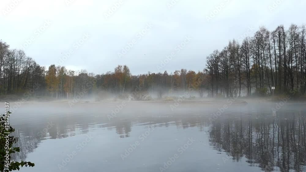 milky white river, thick fog lies low over the river, autumn landscape milky white river, thick fog lies low over the river, autumn landscape