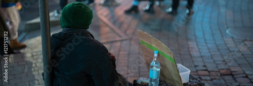 Homeless man outside in winter photo