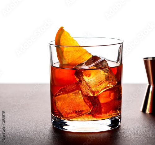 Old Fashioned cocktail with bourbon, sugar, angostura and orange zest, served over ice in a lowball glass. A classic alcoholic drink for parties or quiet evenings.