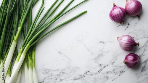 Fresh green onions and red onions on a marble countertop with ample copy space for text placement photo