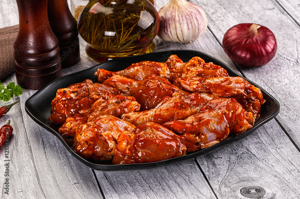 Raw marinated buffalo chicken wings Raw marinated buffalo chicken wings