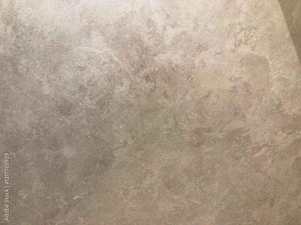 Naklejka premium A low-resolution image of a textured concrete or aggregate wall with muted shades of grey and brown