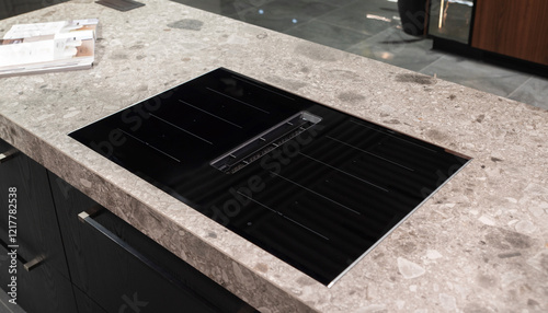 Canvas Print Induction stove hob with integrated extractor on stone countertop