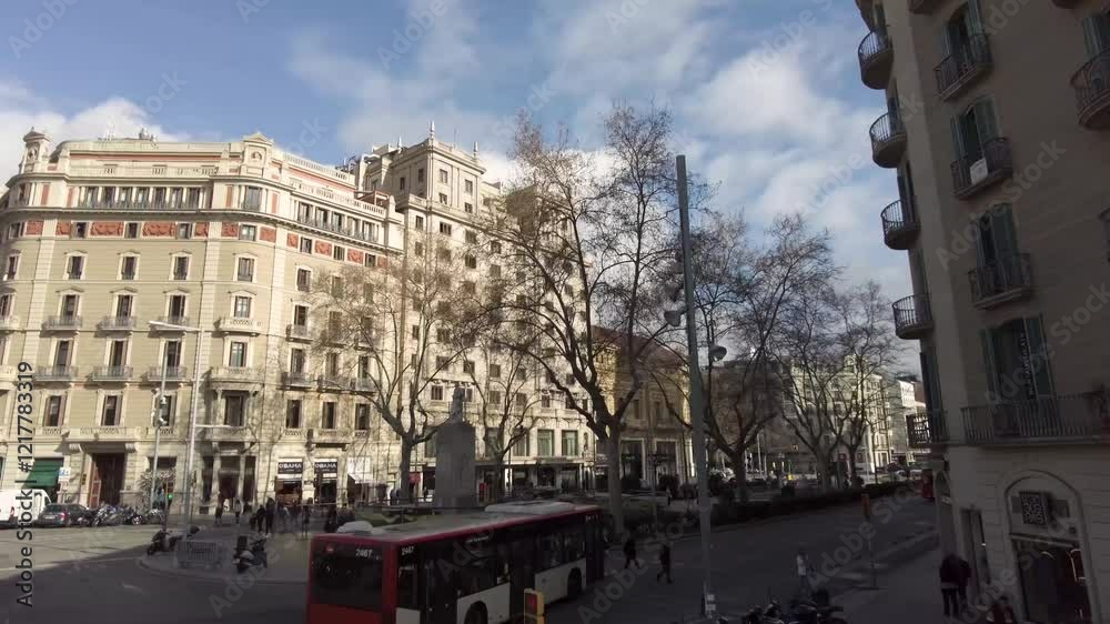 Aerial view from top of a double decker bus driving around the streets of Barcelona, catalonia spain on a sunny day in spring Aerial view from top of a double decker bus driving around the streets of Barcelona, catalonia spain on a sunny day in spring