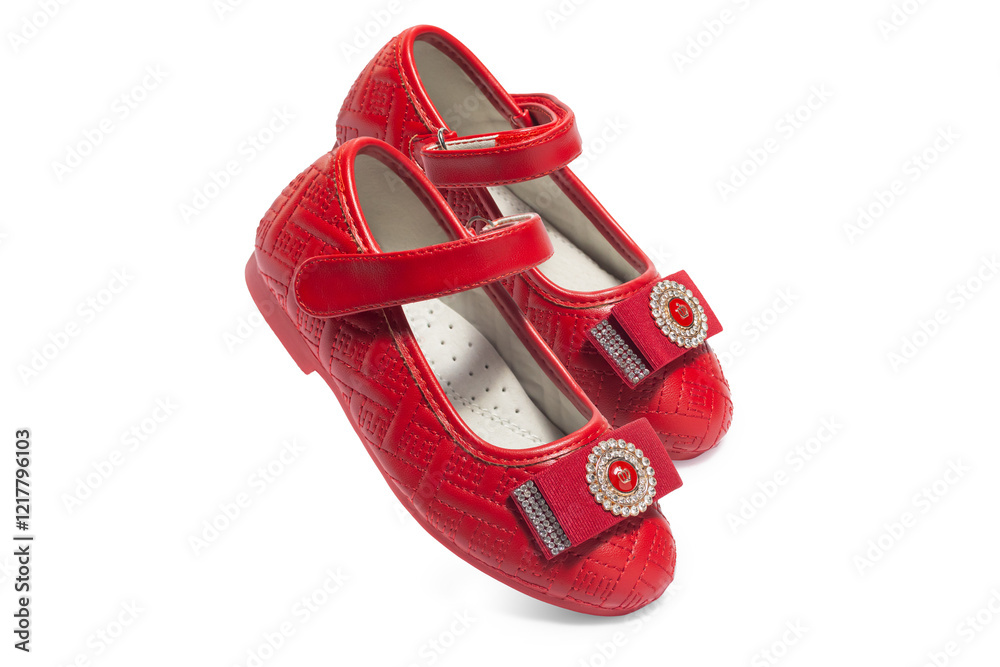 Red leather girls' ballerinas with bow on white background Red leather girls' ballerinas with bow on white background