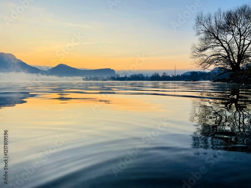 sunrise on the lake with orange and blue shades 