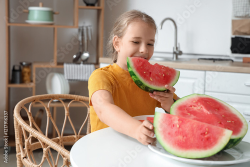 Happy little girl eating fr...