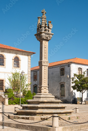 View of the sixteenth century gothic manueline style granite pillory and the city hall building of Vila Nova de Foz Coa, Portugal photo