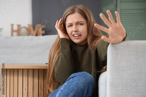 Young woman having panic at...