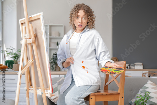 Female artist in dirty shir...