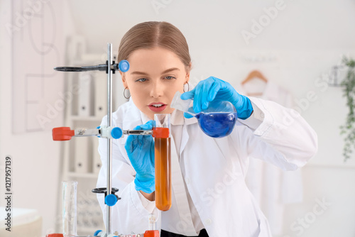 Female chemist conducting e...