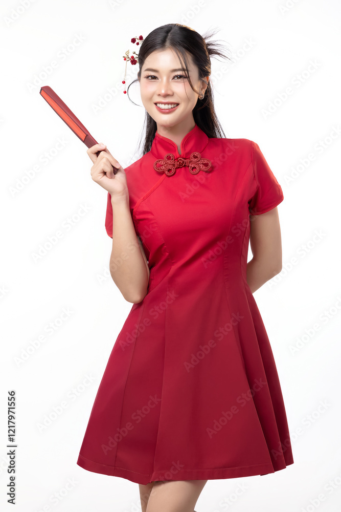 Portrait of joyful beauty Asian woman in red Cheongsam Chinese traditional dress pointing red fan for Chinese New Year festival content. Portrait of joyful beauty Asian woman in red Cheongsam Chinese traditional dress pointing red fan for Chinese New Year festival content.