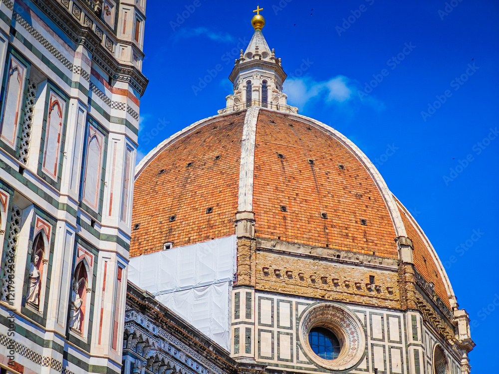 Fototapeta premium Cathedral of Santa Maria del Fiore. Fragments and elements of Florence Duomo basilica facade. Close up dome photo
