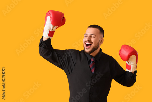 Happy businessman with boxi...