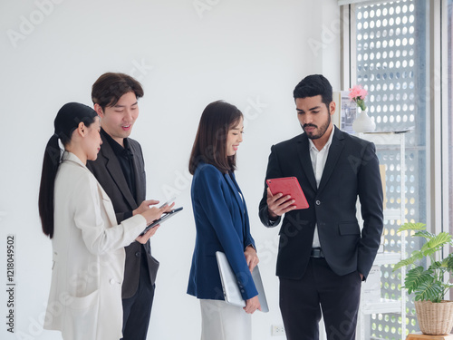 Business man and woman asian group team standing smile cheerful talk looking holding tablet and hands up happy with in agreement ready new project job for work in room office company white background photo