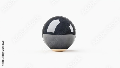 A sleek black ceramic sphere sits elegantly on a light background, showcasing modern design aesthetics