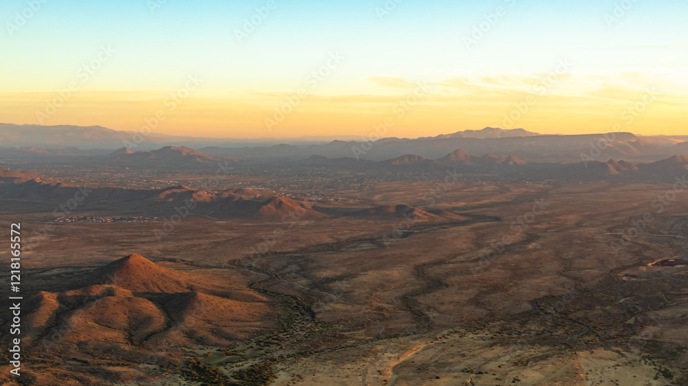 Sonoran Desert mountains and dirt fields in Phoenix Arizona on an autumn October day. Photo taken during sunrise	