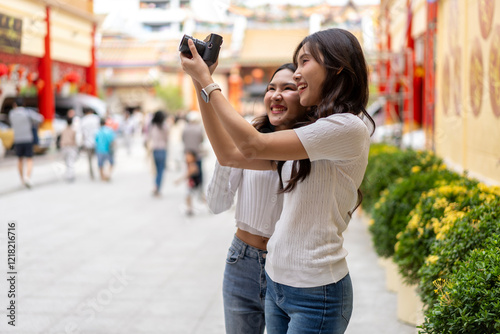 Joyful Young Friends Celebrating on Chinese New Year at china town photo