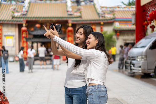 Joyful Young Friends Celebrating on Chinese New Year at china town photo