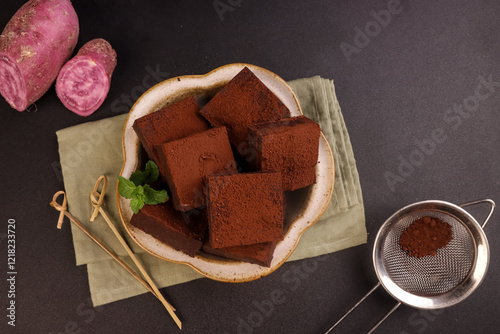 Sweet Potatoes Nama Chocolate Garnish with Mint Leaf. photo