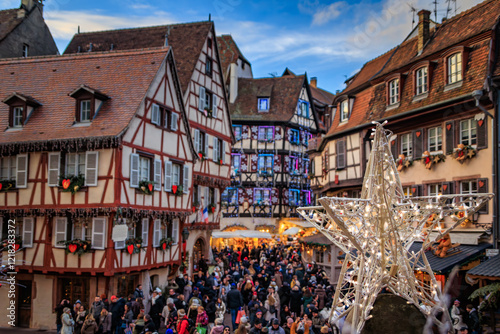 Принти на полотні Crowds in Colmar, France, half timber houses decorated for Christmas Market