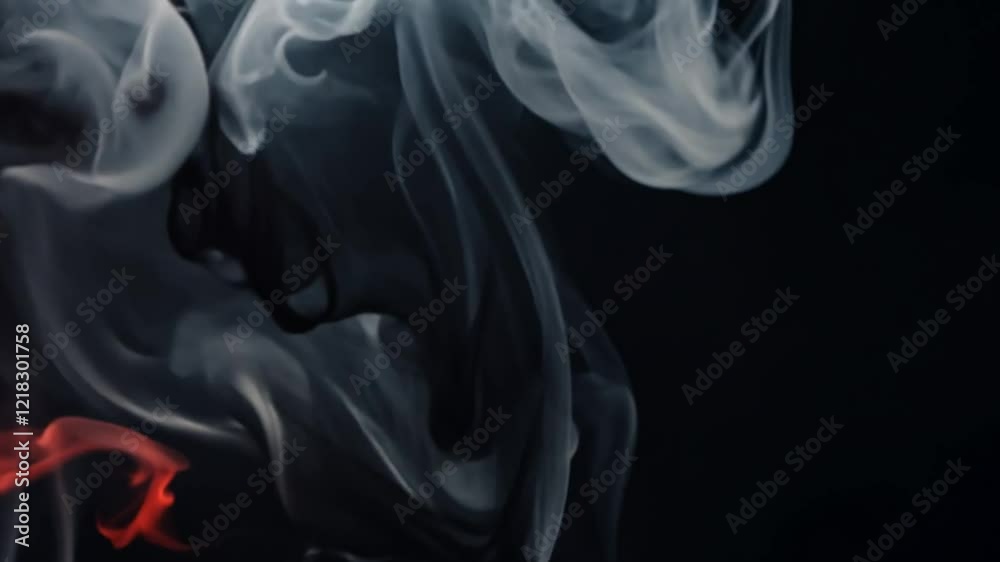 Abstract swirling smoke in black, white, and red colors creating a dramatic and artistic background Abstract swirling smoke in black, white, and red colors creating a dramatic and artistic background