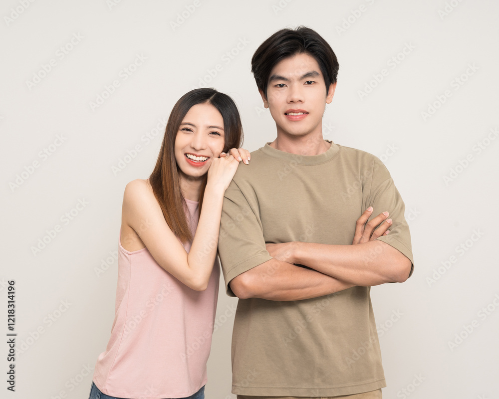 Happy asian couple attractive in various action gesture standing on isolated white background. Cheerful Smiling young man and woman Happy asian couple attractive in various action gesture standing on isolated white background. Cheerful Smiling young man and woman