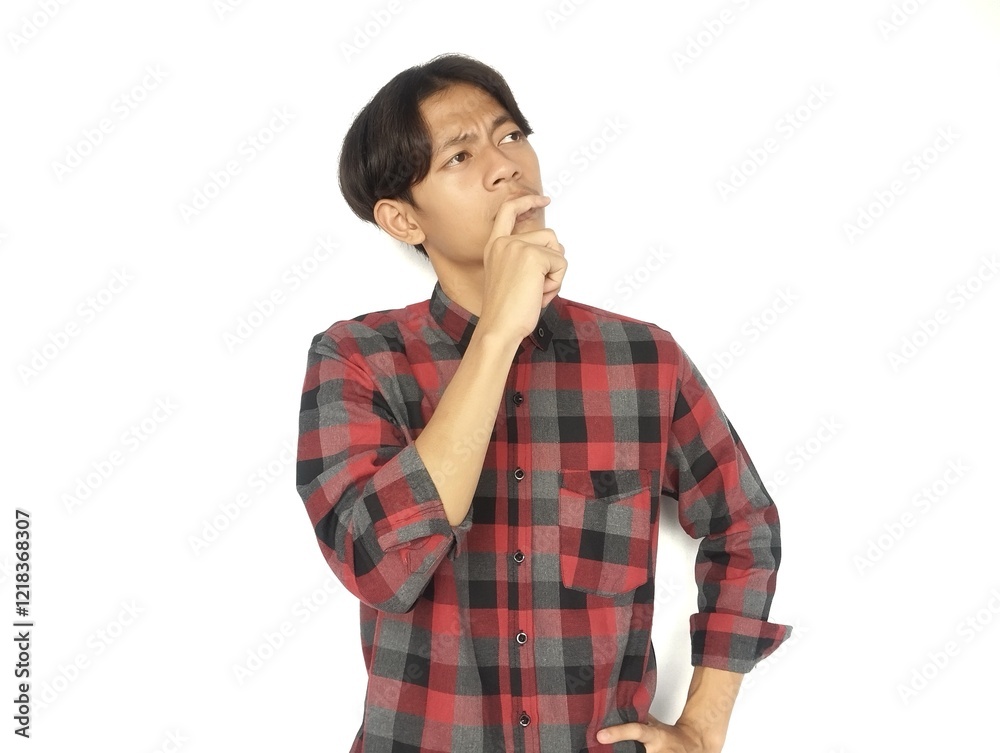 Young Asian man is thinking with eyes looking up, thinking, imagining,
Young Asian man is thinking with eyes looking up, thinking, imagining,